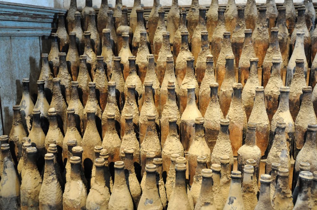 Old Sherry bottles covered in dust, Bodegas Tio Pepe, Jerez de la Frontera, Spain